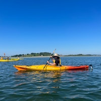 Jerrianne kayaking on the ocean